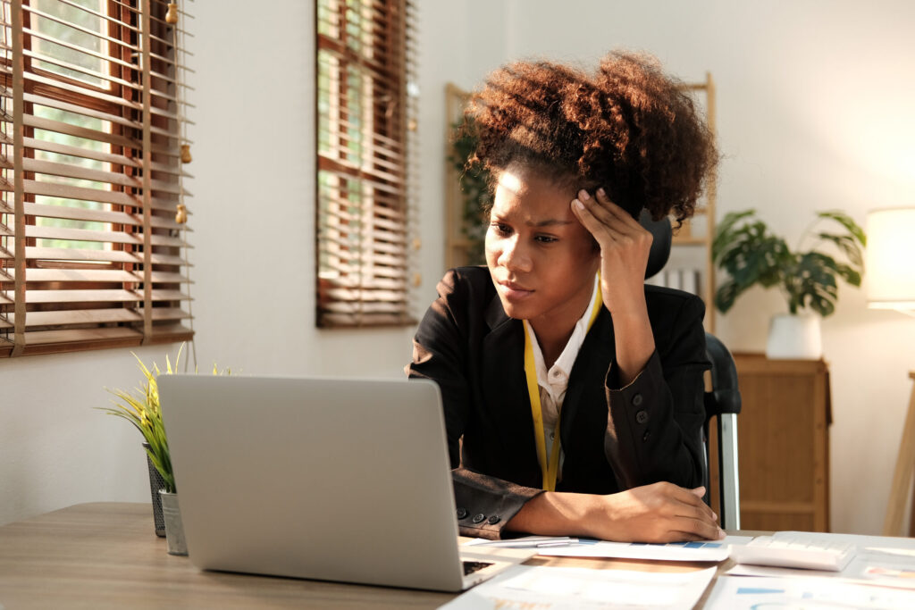 Woman on computer frustrated with insurance